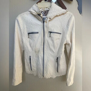 Ivory colored organic leather jacket with intentional distressing and raw edges